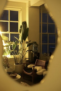 a circular mirror in a living room